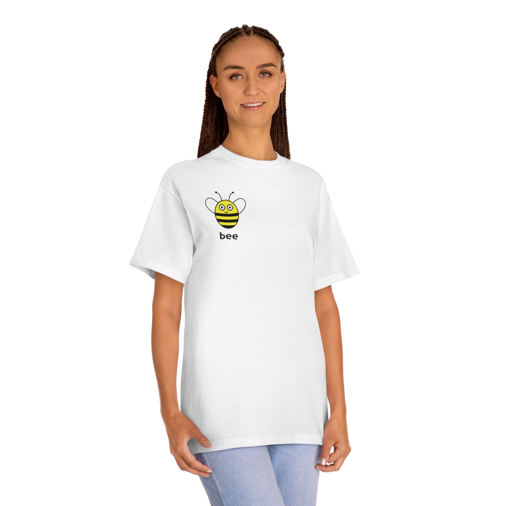 Woman wearing the Bee Leaf graphic tee, showcasing the small bee chest print and casual streetwear fit