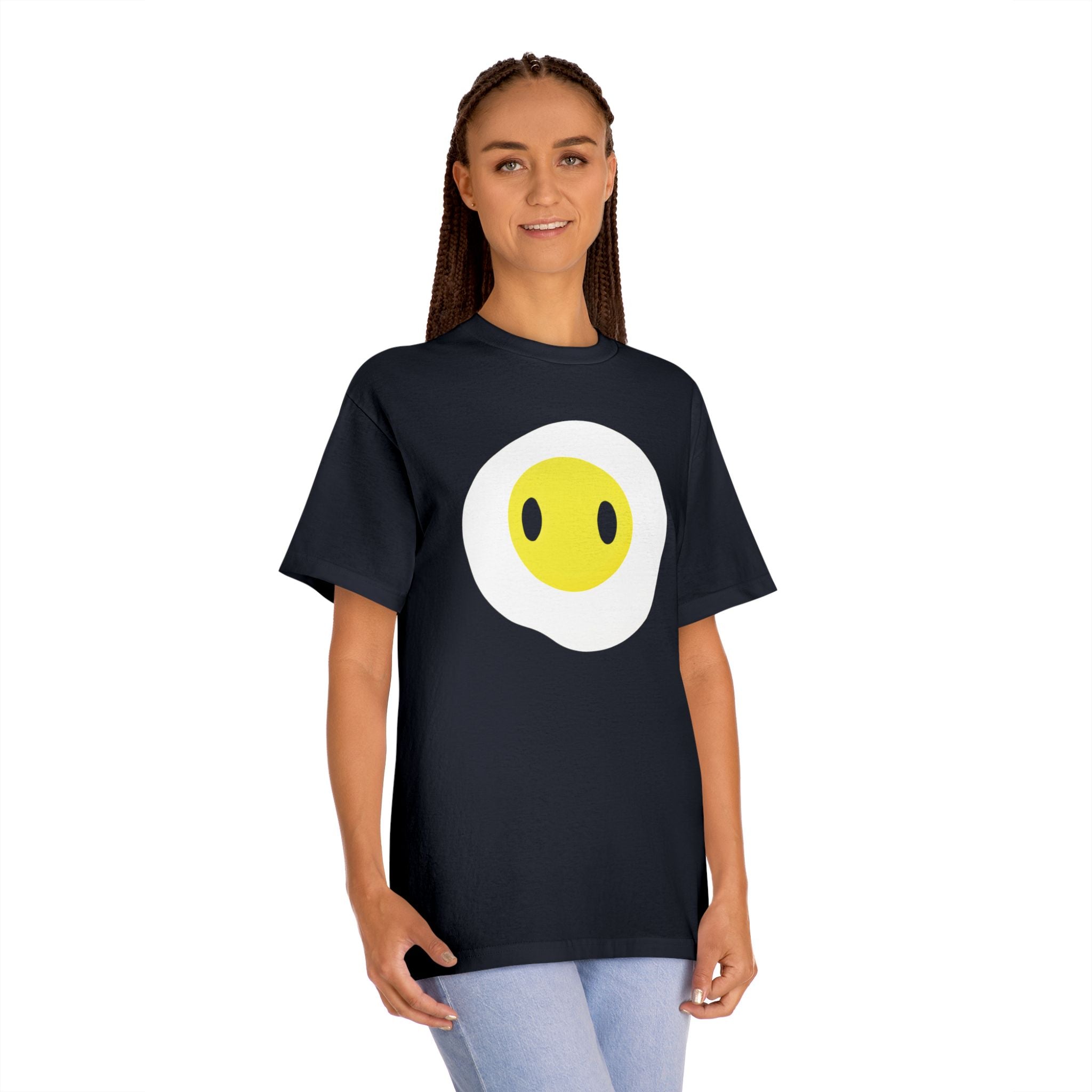 Woman wearing the black Fried Egg graphic tee, showcasing the cute breakfast character print and casual streetwear fit